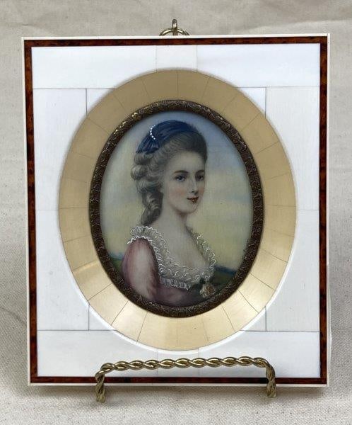 Miniature German Portrait "Mozarts Brauit": A miniature German portrait titled "Mozarts Brauit" with the artist's name inscribed beneath a delicate gold-gilt floral matte. Presented in a finely crafted bone and wood marquetry frame measuring ap