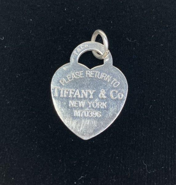 Tiffany & Co. Sterling Silver Heart Tag Pendant: Sterling silver heart tag pendant from the Return to Tiffany collection, marked Tiffany & Co. 925 with unique registration number M70396. Measures approximately 1 1/4" H by 1" W. In good condition wit
