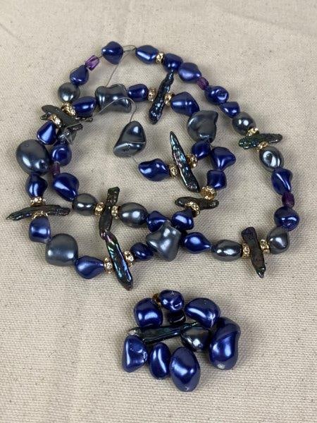 Lot of Colored Faux Baroque Pearls: Two strands of colored faux baroque pearls with accenting rhinestone beads, together with additional loose beads. In good condition with minor loss to coloring.