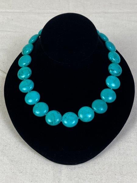 Turquoise Bead Necklace by Lucas Lameth: Necklace of polished turquoise beads, completed with a sterling silver clasp and hanging tag stamped LUC 925 CN. Total length approximately 20". In good condition with light wear consistent with age a