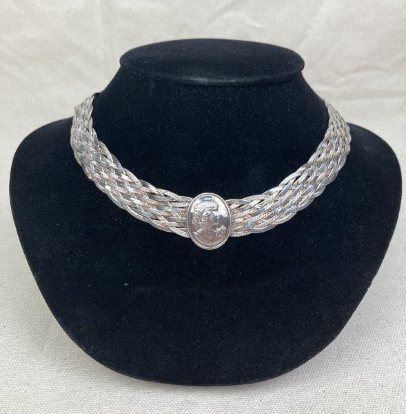 Sterling Silver Braided Choker with Cameo Medallion: Braided sterling silver choker centered with an oval medallion featuring a finely carved profile cameo. Marked 925 Made in Italy. Measures approximately 16" long. In good condition with light wear con