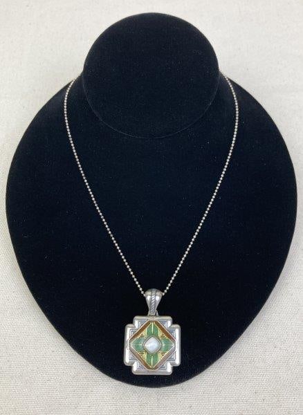 Carolyn Pollack Relios Enamel Necklace: Beautiful sterling silver necklace featuring a green and orange enamel design surrounding a central mother-of-pearl stone. Pendant marked with the Carolyn Pollack Relios maker's mark on the reverse. P