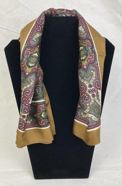 Liberty of London Silk Scarf: Elegant vintage Liberty of London silk scarf featuring a classic paisley pattern in rich shades of brown, green, and burgundy, framed by a complementary border. Measures approximately 23" x 23". In go