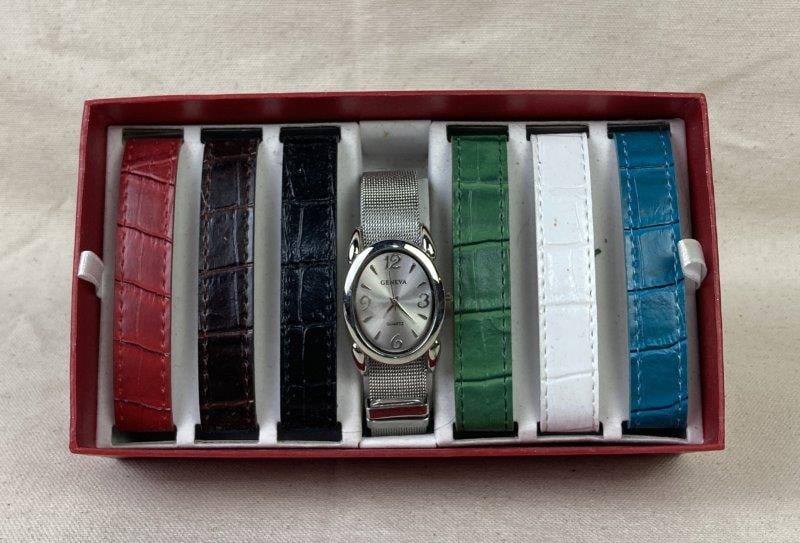 Geneva Quartz Watch with Interchangeable Bands: Elegant Geneva quartz wristwatch presented in its original box, accompanied by multiple interchangeable bands for versatile styling. Features an adjustable band design for a comfortable fit. Appears l