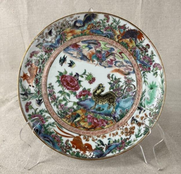 Early Chinese Famille Rose Plate with Leopard: Decorated with a central leopard motif surrounded by vibrant floral details, the border featuring a variety of animals including a leaping stag. A lively and unusual example of famille rose decoration