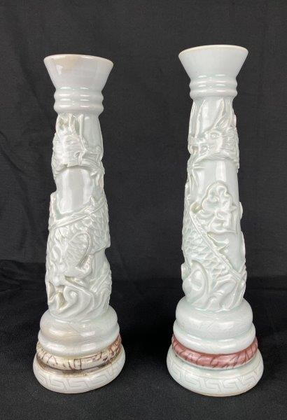 Dragon Motif Celadon Candlesticks: Pair of finely designed candlesticks, each featuring beautifully detailed dragon forms encircling the body with robust construction and striking presence. Each measures approximately 12 5/8" H x 4" in
