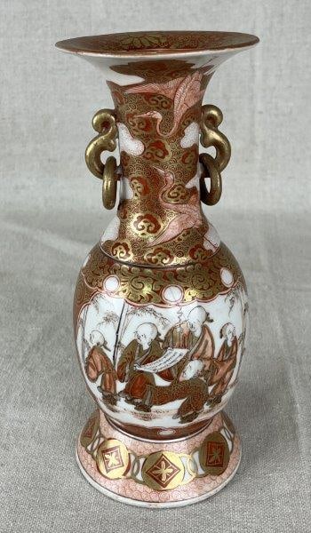 Fine Japanese Kutani Vase: Finely decorated Kutani vase, featuring figures with a scroll in a scholarly setting on one side, and flora and fauna on the reverse. Accented with gilded details throughout and signed to base. Measur
