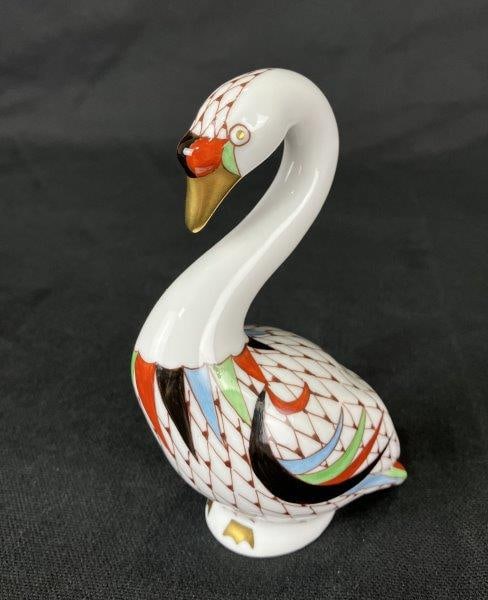 Holloháza Porcelain Swan Figurine: Hungarian porcelain swan figurine by Hollohaza, decorated with geometric patterning characteristic of the maker’s distinctive design tradition. Measures approximately 5" H x 3 1/2" W x 1 3/4" D 
