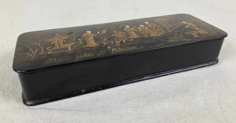 Japanese Lacquer Box: Elegant black lacquer box finely decorated with a Japanese scene rendered in delicate gold leaf. Measures approximately 1 7/8" H x 10 5/8" W x 3 5/8" D, Good condition with age-appropriate wear to the