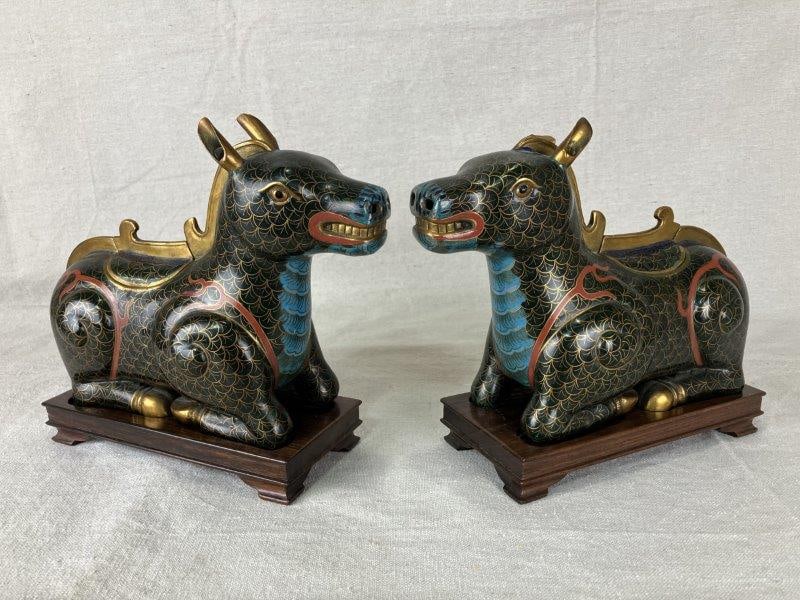 Pair of Chinese Cloisonné Horses: Finely detailed pair of cloisonné horses decorated in rich teal and red enamels with gilded accents. Each rendered in a traditional stylized manner, showcasing the artistry of Chinese metalwork a