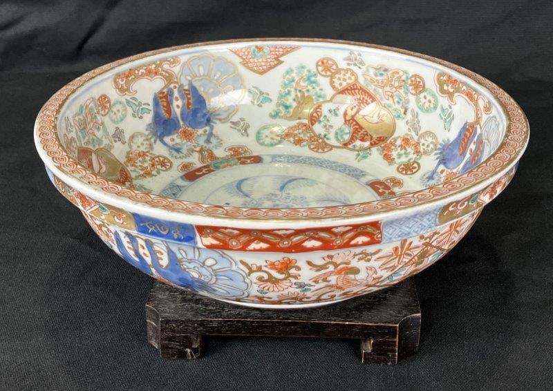 Imari Hand-Painted Porcelain Bowl: Traditional Japanese Imari porcelain bowl, decorated in a rich palette of red, gold, and blue tones with detailed hand-painted designs characteristic of the style. Measures approximately 3 3/8" H x 9 