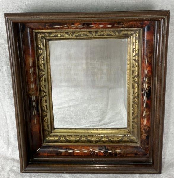 19th Century Mirror with Walnut and Burl Wood Frame: Elegant mirror featuring a walnut frame with carved burlwood-style liner and an innermost gilt liner adding refined detail. Frame measures approximately 15 1/2" H x 13 1/2" W x 3 5/8" D. Condition: Go