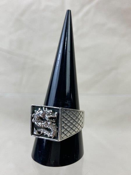 Samuel B. Men’s “Shanghai” Sterling Silver Ring: Handsome sterling silver signet ring by Samuel B., featuring a bold dragon motif across the face with scaled sides adding detail and texture. Ring size 10 1/2. Good condition.
