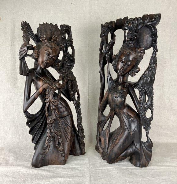 Balinese Figurative Wood Carvings: Beautifully executed Balinese wood carvings depicting idealized female figures in traditional style, echoing the iconography of Ni Bawang accompanied by birds. Exemplary of the regionâ€T