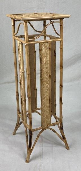 Bamboo Plant Stand: Beautifully crafted bamboo plant stand with natural warmth and charm, perfect for displaying plants or decorative objects. Measures approximately 32" H x 10 1/4" W x 10 1/4" D. Good condition.