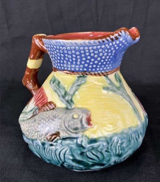Shorter & Son Majolica Pitcher with Fish Motif: English made and charming majolica pitcher featuring sculptural fish motif against a richly textured yellow ground, with an applied handle. A fine decorative example of majolica ware. Measures approxi