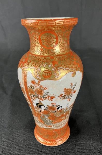 Small Japanese Kutani Vase, Late 19th Century: Late 19th-century Kutani porcelain vase decorated with figures of women in a domestic setting, accented by floral motifs and intricate patterns. A fine example of Japanese artistry and detailed brushw