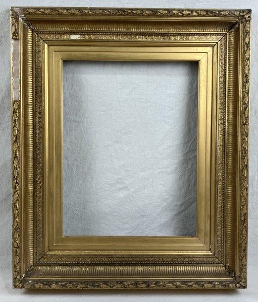 19th Century Giltwood Frame: A handsome 19th-century gold gilt frame with finely molded decoration. Frame measures approximately 23 1/2" x 27 3/4", with an inner opening of 14" x 18 1/4". Some loss to the frame and molding.