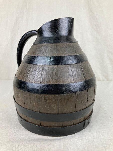 French Wood Wine Jug: Handsome French wine jug crafted from wood and reinforced with iron banding, displaying a warm aged patina that speaks to its history and use. Measures approximately 12 5/8" H x 10 1/2" W x 10 3/4" D 
