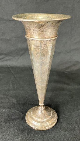 Sterling Silver Trumpet Vase: Elegant weighted sterling silver trumpet vase, designed with graceful proportions and a highly reflective surface. Measures approximately 12 1/2" H x 5 1/2" in diameter and shows some tarnishing with 