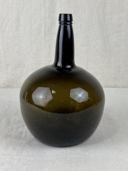 19th Century Carboy: Handsome 19th-century dark green glass carboy, etched on the side it says W x M. Measures approximately 10 7/8" H x 7" W x 7 1/4'' D, Good condition.
