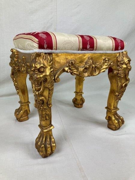 French Style Giltwood Stool: Elegant giltwood stool featuring finely carved lion legs terminating in paw feet, topped with a high-quality fabric seat. The frame retains an aged patina. Measures approximately 19 3/4" H x 20" W x 1