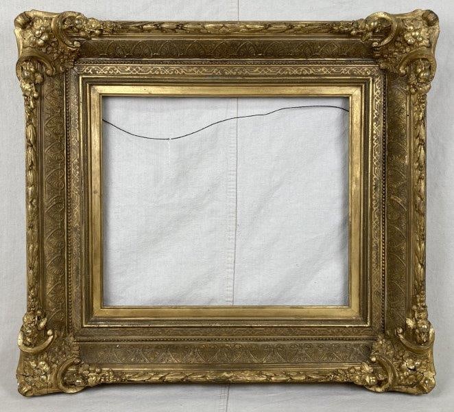 19th Century Ornate Gilt Frame: Stunning 19th-century gilt frame richly adorned with ornate floral and berry motifs, showcasing the fine decorative craftsmanship of the period. Outer frame measures approximately 24 1/2" x 26 3/4", w
