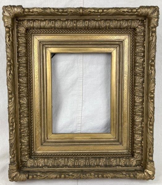 Gilt 19th Century Frame: Elegant 19th-century gilt frame featuring a richly molded berry and floral motif, a fine example of decorative craftsmanship from the period. Outer frame measures approximately 21 5/8" x 25", with an 