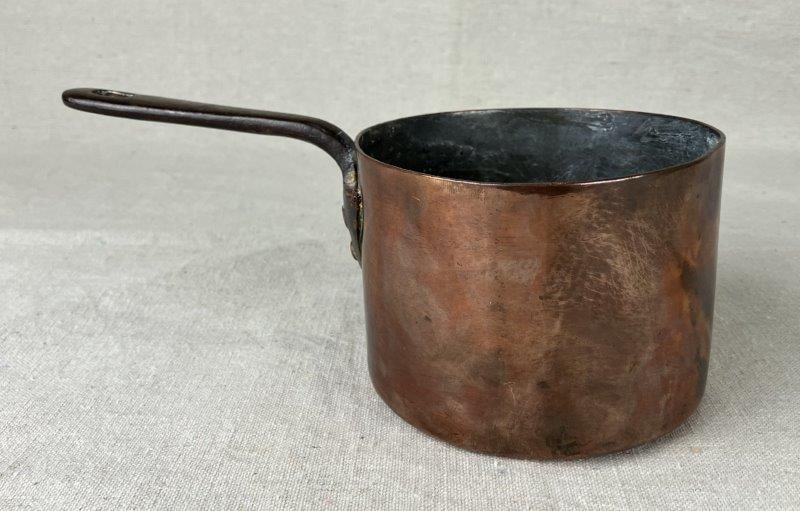 A & N Army Navy Cooperative Society Copper Pot: Handsome copper pot with a rich, warm surface, stamped A & N on the base for the Army Navy Cooperative Society. Measures approximately 3 1/4" H x 5" W x 9" D. Shows some wear and markings with age-rel