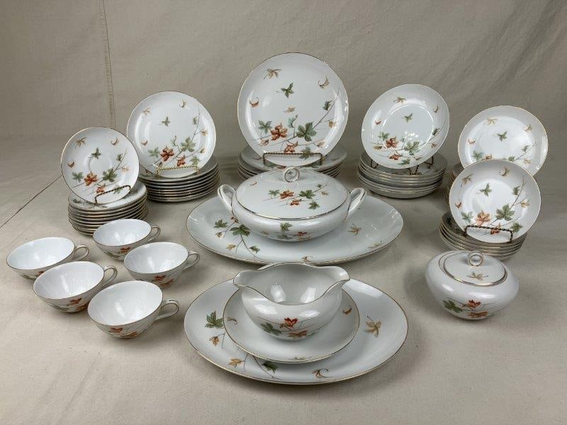 Sixty-Five Pieces of Japanese Dinnerware: A stunning set of Japanese dinnerware featuring vibrant floral designs, including dinner plates, salad plates, serving dishes, and more. Assorted sizes. The largest platter measures approximately 16 1