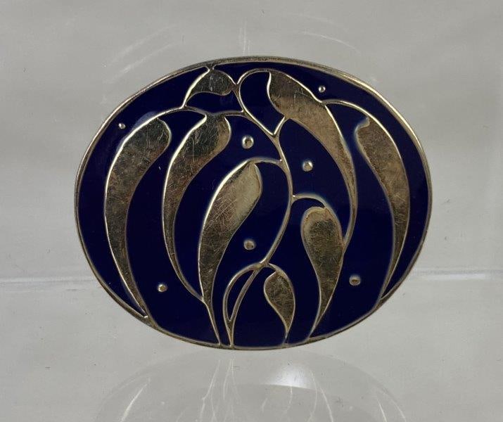 Josef Hoffmann Neue Galerie New York Brooch,1910: Wonderful Vienna sucessionist piece. Elegant brooch in sterling silver with gold vermeil, featuring a stylized plant motif centered with blue resin detail. Measures approximately 1 1/4" in diameter. T
