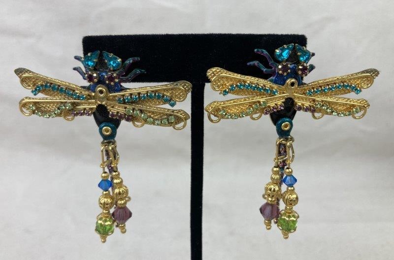 Vintage Lunch at the Ritz Dragonfly Earrings: Charming gold-tone earrings featuring whimsical dragonfly motifs adorned with multi-colored rhinestones and dangling charms. Stamped Lunch at the Ritz on the reverse. One earring measures approximatel