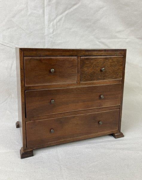 Minuture Chest Jewelry Box: Elegant jewelry box crafted from warm-toned wood with an inlaid lighter wood monogram "GML" on the lid. Features a refined, sturdy form and smooth finish. Blue velvet lining. Measures approximately 7 