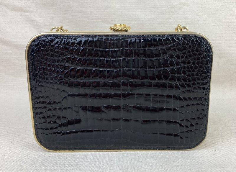 Chimas Black Alligator-Style Leather Clutch, Made in Italy: Elegant vintage Chimas clutch crafted in Florence, Italy, featuring black alligator-style leather accented with gold-tone hardware and strap. Interior lined in light brown suede and marked with maker'