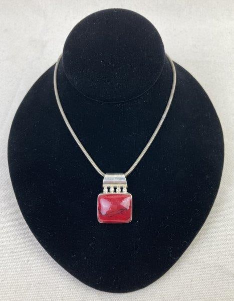 Sterling Silver and Red Jasper Pendant Necklace: Contemporary Mexican, artisan crafted. sterling silver necklace featuring a red jasper pendant with a sleek modern design accented by silver beading at the top of the setting. Pendant marked 925 Mexic
