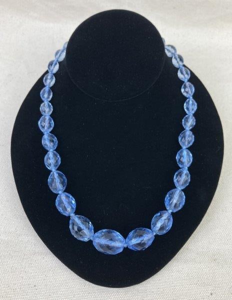 Blue Cut Glass Beaded Necklace: Beautiful crystal necklace featuring faceted blue cut glass beads with rich periwinkle tones and prismatic dimensionality. Finished with a silver-tone clasp. Measures approximately 24" long. In good c