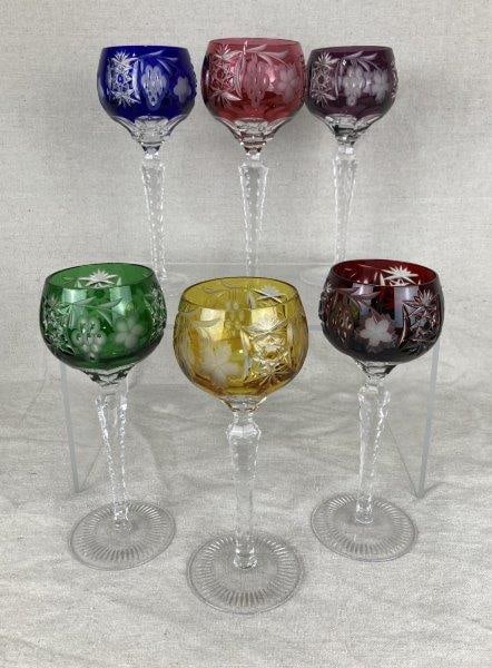 Six Nachtmann Cut to Clear Wine Hock Glasses: Elegant set of six glasses featuring vibrant tones cut to clear with intricate faceted detailing. Each exhibits fine craftsmanship and refined proportions, one measuring approximately 8 3/8" H x 3 1/4