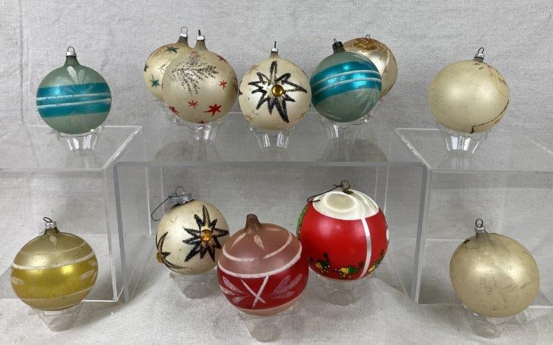 Vintage Max Eckardt & Sons Glass Christmas Ornaments: Set of twelve hand-painted circular glass ornaments with glitter accents, housed in the original box; one ornament measures approx. 3 in. diameter. Box measures approx. 3 1/2'' H × 11 1/8'' W 