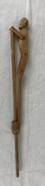 Folk Art Monkey Toy: Charming wooden folk art monkey toy featuring hand-painted details and a playful flipping action. Displays a warm aged patina and delightful primitive character. Measures approximately 19 1/8'' L. Goo