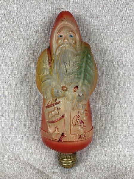 Vintage Santa Claus Figural Light Bulb: Charming vintage Santa Claus figural light bulb, likely made in Japan during the 1920-1930s, a fine example of early 20th-century holiday craftsmanship. Features hand-painted details and is marked 
