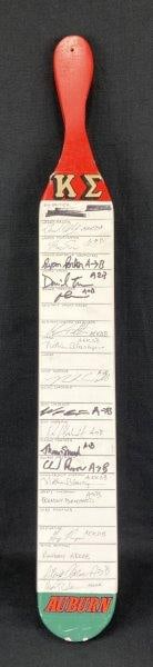 Auburn Fraternity Paddle: Vintage college memorabilia paddle featuring hand-painted red and green tones and inscribed fraternity positions with multiple signatures from members. A nostalgic piece reflecting Auburn University G