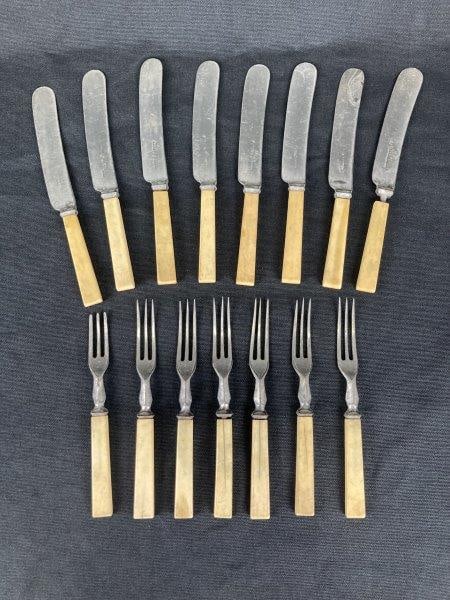 Bone Handle Silver Plate Civil War Era Flatware: Elegant 19th-century flatware set featuring eight knives and six forks, each with classic bone handles and silverplate fittings typical of the Civil War era. The knives measure approximately 8" H x 5/