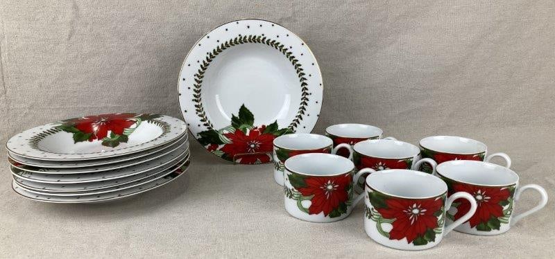 American Atelier “Poinsettias” Dinnerware: A festive Suzanne Evans design featuring vibrant red poinsettias and green foliage on a cream ground. Set includes eight bowls and eight mugs. Each bowl measures approximately 9" in diameter. In good