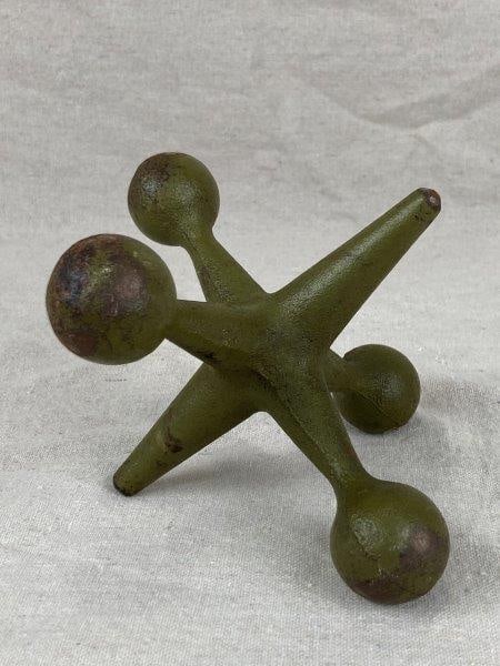 Cast Iron Jack Sculpture: Distinctive cast iron jack sculpture featuring a dark green painted surface with an appealing worn aged patina. Measures approximately 4 5/8'' H x 4 1/4'' W x 5 3/4'' D. Good condition with light pain