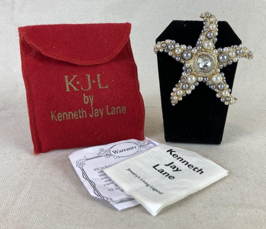 Kenneth Jay Lane “Star of the Sea” Brooch: Kenneth Jay Lane original Star of the Sea brooch, an iconic design adorned with clusters of faux pearls and sparkling rhinestones set in an elegant gold tone finish. The piece retains its stamped make