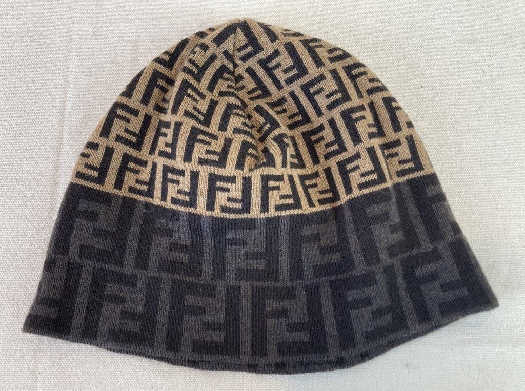 Fendi Wool Knit Beanie Cap: Fendi wool knit beanie cap featuring the brand's distinctive logo pattern throughout in a refined palette of light taupe, grey, and charcoal tones, creating a classic yet modern look. Retains the orig