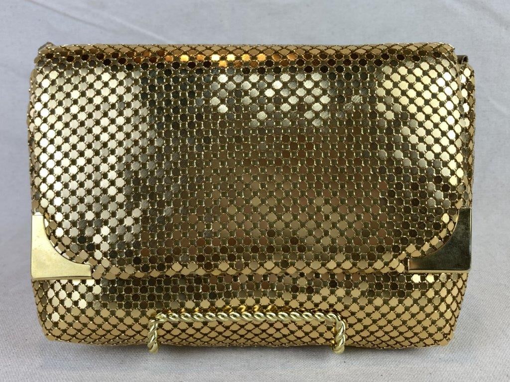 La Regale Gold Tone Chainmail Crossbody Bag: Vintage La Regale gold tone mesh crossbody bag crafted in a flexible metal chainmail form with a soft gold leather interior. Retains its original interior serial number label and fabric tag noting it