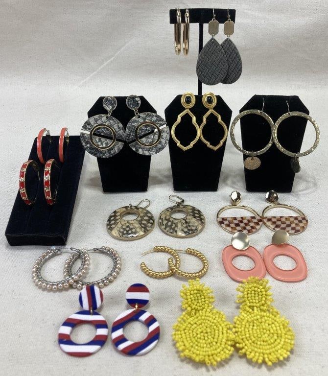 Fourteen-Piece Earring Assortment Featuring Julie Vos: Assortment of fourteen earrings highlighted by a standout pair of Julie Vos earrings featuring central black cabochons framed in rich gold with an elegant gold dangle element, traditionally crafted in