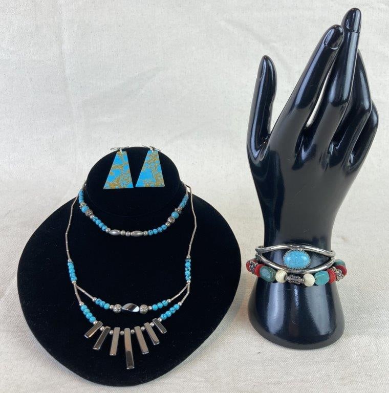 Grouping of Native American–Style Jewelry: Group of Native American–themed jewelry including two necklaces of silvertone beads accented with faux turquoise, one also featuring graduated hematite; a silvertone cuff bracelet with a central