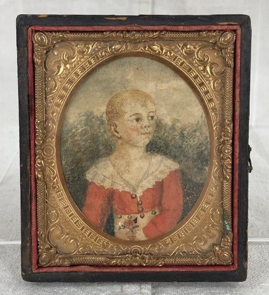 19th Century Miniature Watercolor of Child: Delicate watercolor portrait of a child in a red dress with a white lace collar holding a flower, presented in an oval gilt-inlaid frame with leather back featuring embossed design. Aged patina. Measu